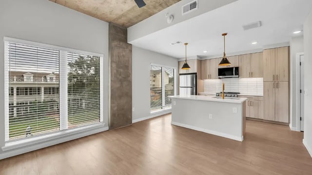 Modern kitchen with island and appliances kitchen at The Sinclair in Austin Student Accommodation