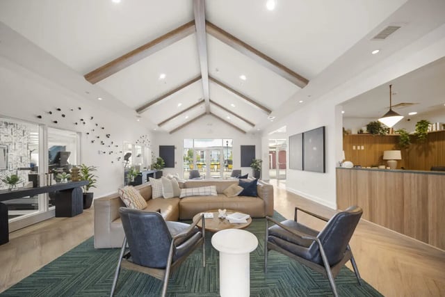 Sofa chairs coffee table reception desk lounge area at Block20
