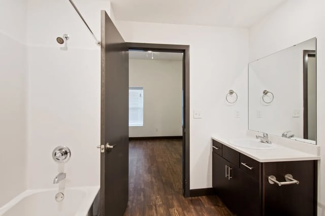 Bathtub shower vanity sink and mirror Bathroom at 800 South in Springfield Student Accommodation