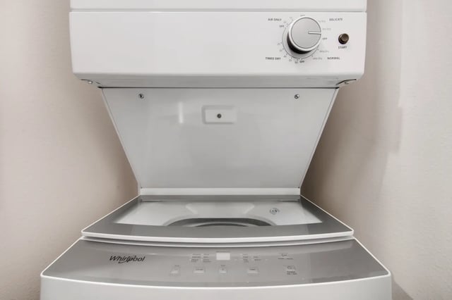 Stacked white Whirlpool washer and dryer appliance at 800 South in Springfield Student Accommodation