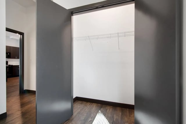 Empty closet with shelving and dark wood floor at 800 South in Springfield Student Accommodation