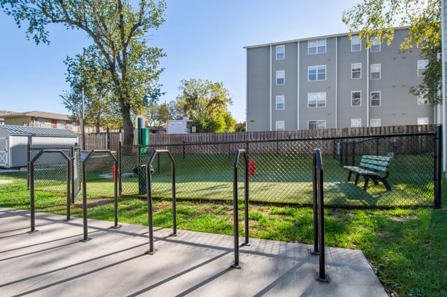 Dog park with bench and agility equipment outdoor area at 800 South in Springfield Student Accommodation