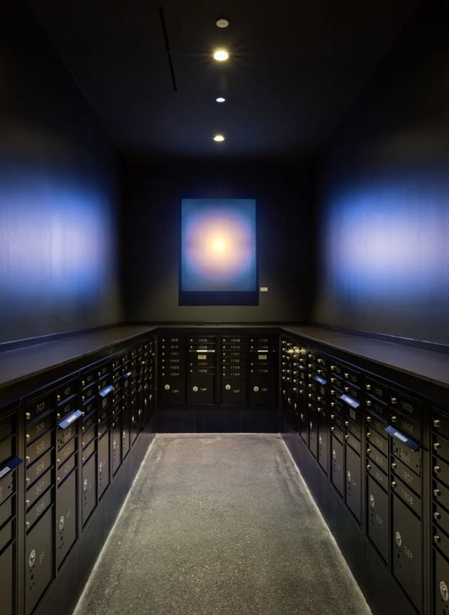 Mailboxes with numbered doors and artwork interior at Straits Row in Chicago Student Accommodation