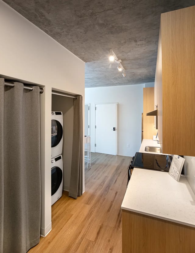 Stacked washer dryer by closet door kitchen counter Image Type at Straits Row in Chicago Student Accommodation