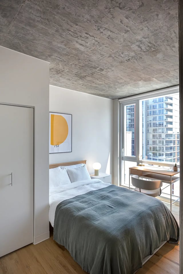 Bed desk closet modern apartment bedroom at Straits Row in Chicago Student Accommodation