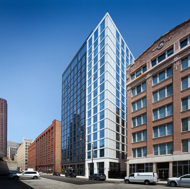 Modern glass building with brick buildings exterior at Straits Row in Chicago Student Accommodation