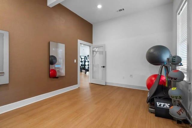 Mirror exercise balls and weight rack gym area at Astoria in Denton Student Accommodation