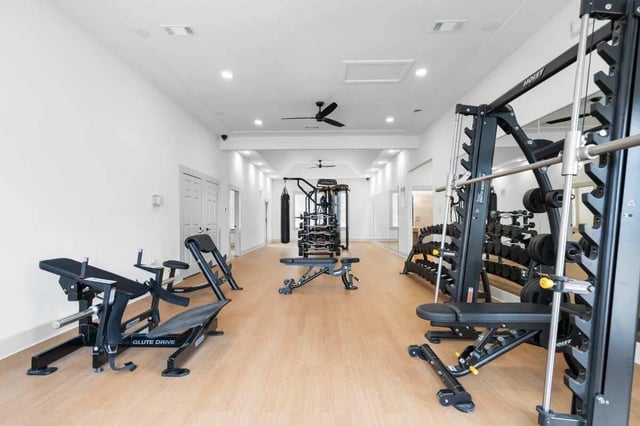 Gym equipment weights racks and benches gym area at Astoria in Denton Student Accommodation