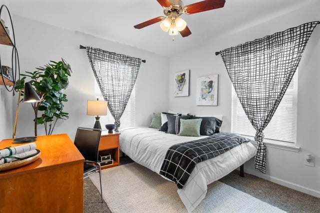 Desk bed ceiling fan framed art bedroom at Astoria in Denton Student Accommodation