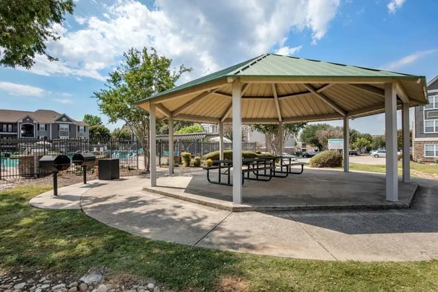 Covered pavilion with picnic tables and grills outdoor area at Astoria in Denton Student Accommodation