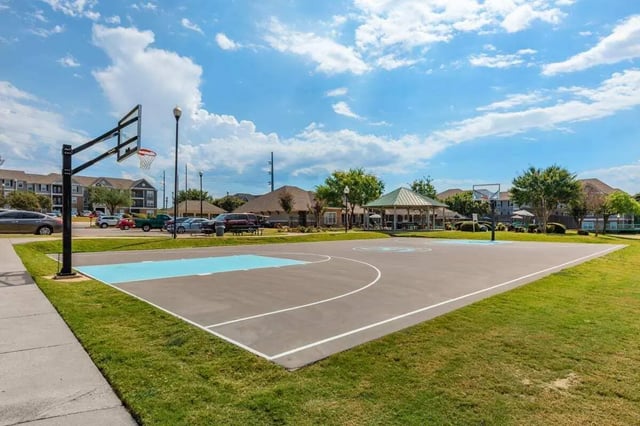 Basketball court with hoop and pavilion playing area at Astoria in Denton Student Accommodation