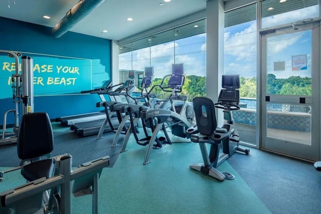 Gym equipment including treadmills and stationary bikes gym at The Bluff at Waterworks Landing in Tuscaloosa Student Accommodation