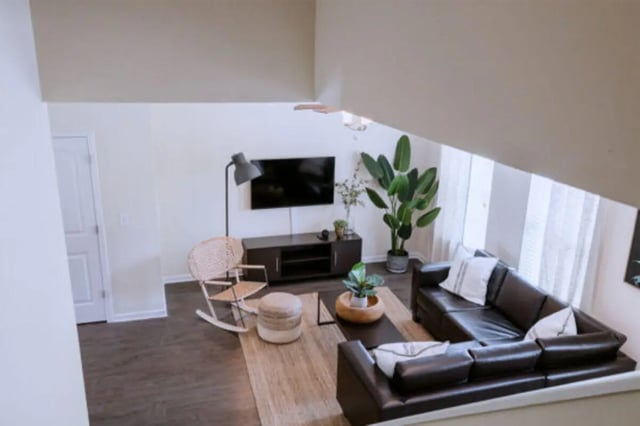 Leather sectional rocking chair plant living room at Athens Ridge in Athens Student Accommodation