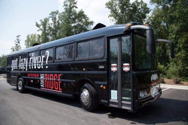 Black bus with text and logos exterior at Athens Ridge in Athens Student Accommodation