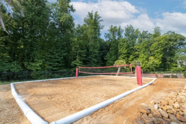 Sand volleyball court with net and poles playing area at Athens Ridge in Athens Student Accommodation