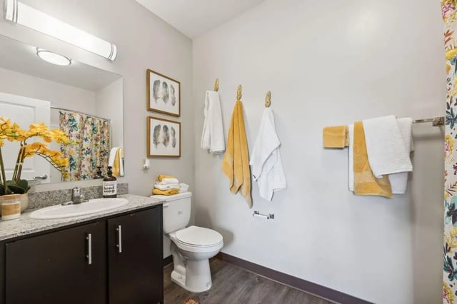 Sink toilet and towels bathroom interior at The Valley Apartments & Townhomes in State College Student Accommodation