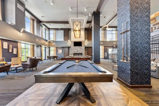 Pool table with cues and balls recreation area at The Valley Apartments & Townhomes in State College Student Accommodation