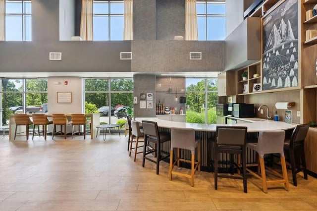 Bar seating and kitchen counter with amenities Living area at The Valley Apartments & Townhomes in State College Student Accommodation