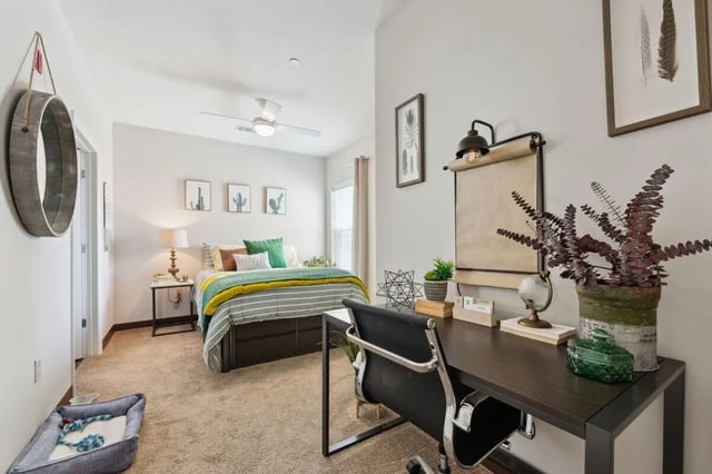 Bed desk dog bed and fan bedroom at The Valley Apartments & Townhomes in State College Student Accommodation