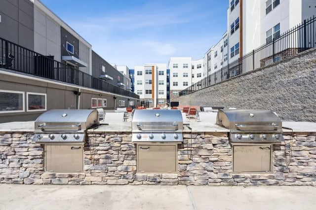 Three stainless steel grills exterior at The Valley Apartments & Townhomes in State College Student Accommodation