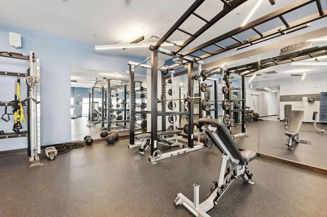 Weight racks benches and balls gym area at The Valley Apartments & Townhomes in State College Student Accommodation