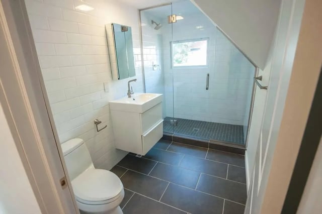 Toilet sink shower with glass door bathroom at Campus Prime in Syracuse Student Accommodation