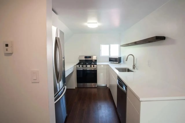 Stainless steel refrigerator stove sink dishwasher kitchen at Campus Prime in Syracuse Student Accommodation