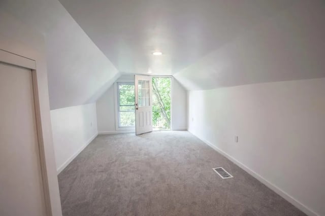 Empty attic room with open door and windows. at Campus Prime in Syracuse Student Accommodation