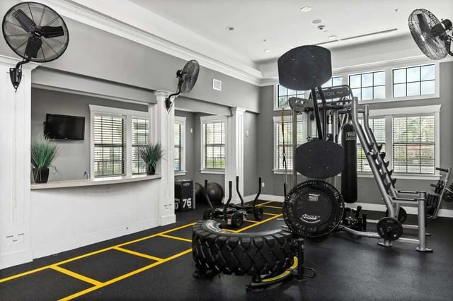 Gym equipment fans and large tire gym. at Campus Quarters in Corpus Christi Student Accommodation