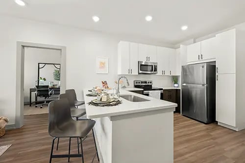 Counter stools stainless steel refrigerator kitchen kitchen at The Jolly Roger in Greenville Student Accommodation