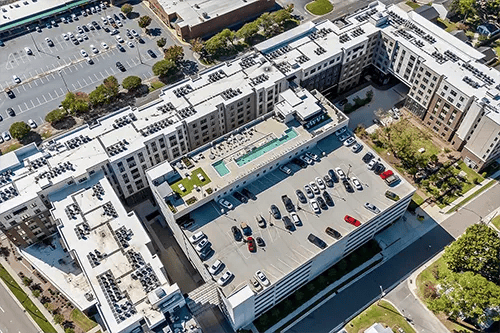 Apartment buildings with parking garage exterior at The Jolly Roger in Greenville Student Accommodation