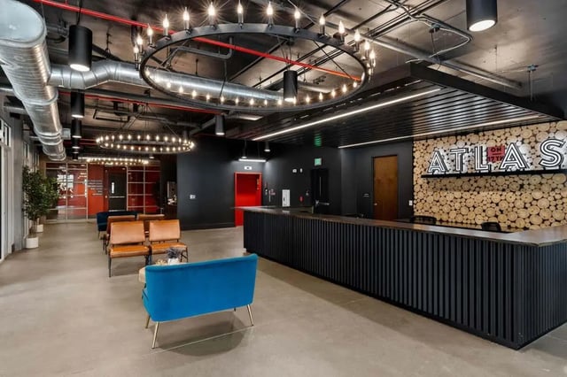 Lobby with reception desk and seating area interior at Atlas on 17th in Bloomington Student Accommodation
