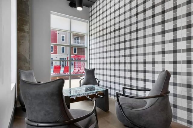 Four chairs foosball table patterned wall lounge at Atlas on 17th in Bloomington Student Accommodation