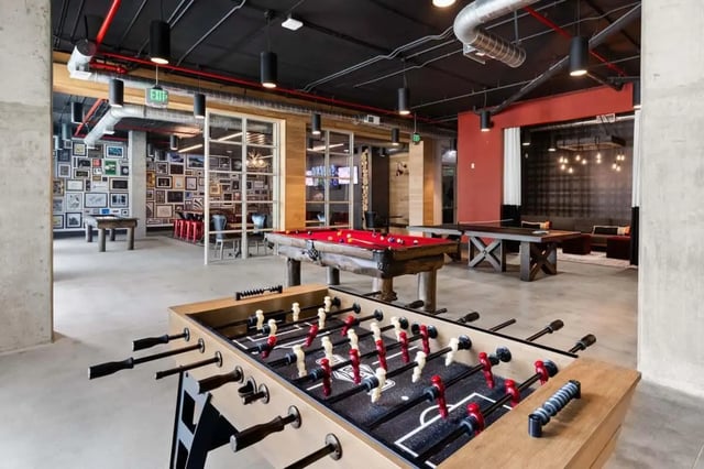 Foosball table billiard table ping pong table lounge area recreation room at Atlas on 17th in Bloomington Student Accommodation
