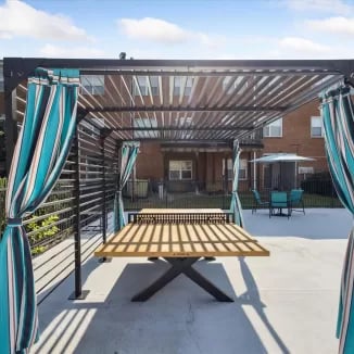 Ping pong table under pergola playing area at Eighteen18 at Southern in Statesboro Student Accommodation