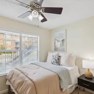 Bed with bedside table and window bedroom at Eighteen18 at Southern in Statesboro Student Accommodation