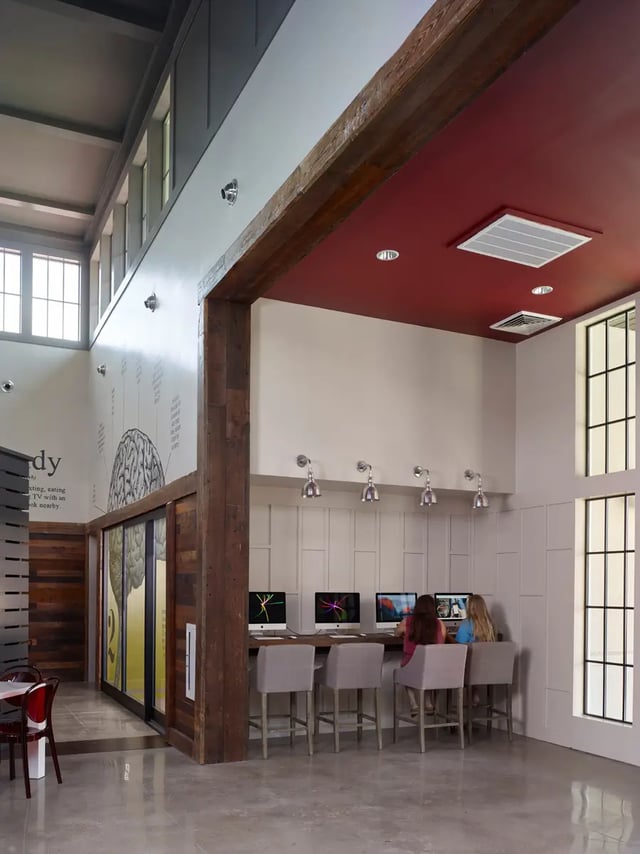 Computer stations with students study area at The Junction at College Station in College Station Student Accommodation