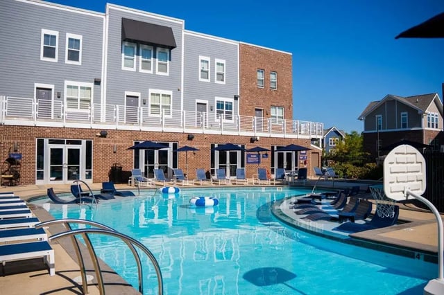 Pool lounge chairs and basketball hoop exterior at The Dillon in Bloomington Student Accommodation