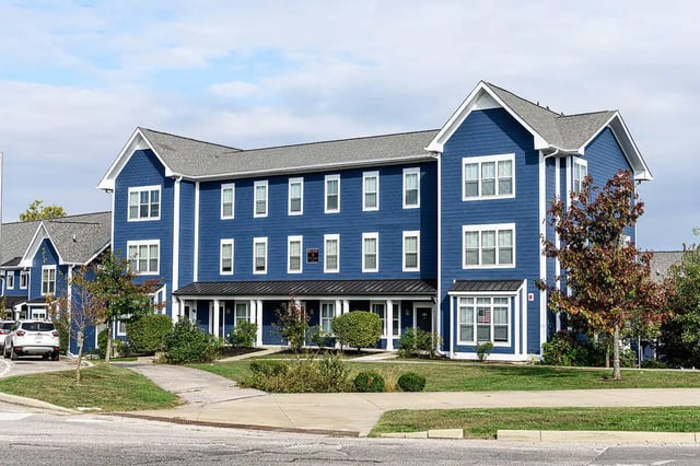 Blue multi story buildings with many windows exterior at The Dillon in Bloomington Student Accommodation