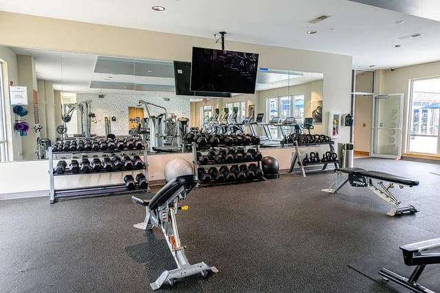 Dumbbells weight benches and treadmills gym at The Dillon in Bloomington Student Accommodation