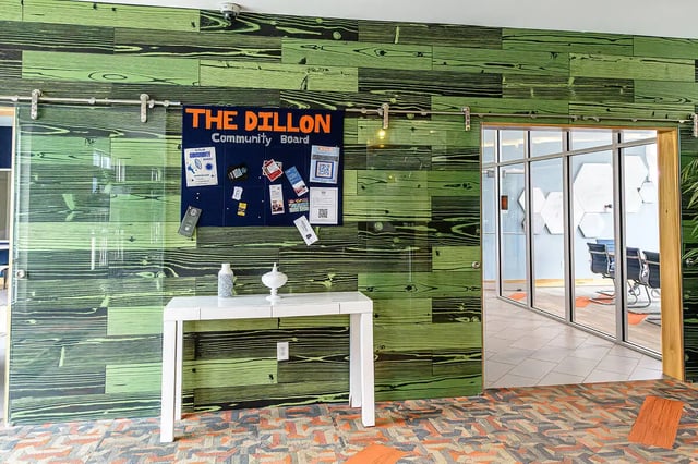 Community board and table entryway area at The Dillon in Bloomington Student Accommodation