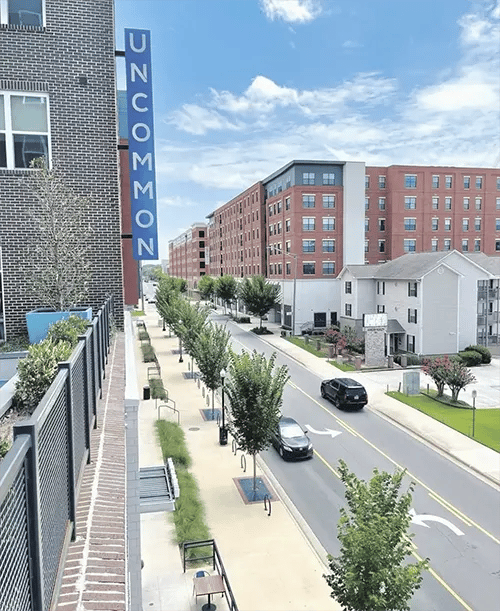 Uncommon building and street exterior at Uncommon Auburn in Auburn Student Accommodation
