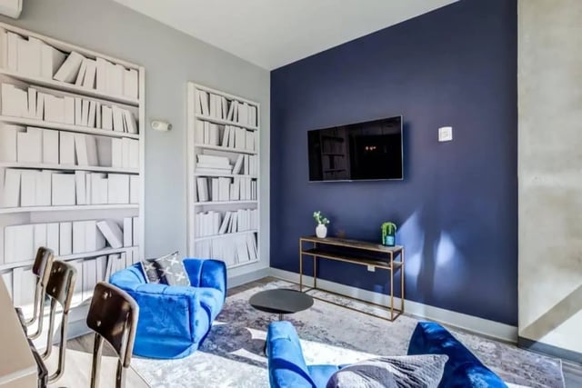 Two blue sofas and a round coffee table Living room at The Boundary At West End in Greenville Student Accommodation