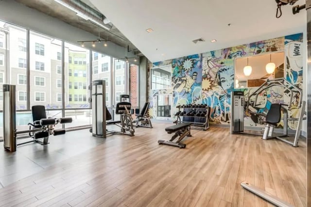 Fitness equipment with comic book mural gym at The Boundary At West End in Greenville Student Accommodation