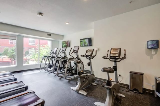 Treadmills ellipticals stationary bikes gym equipment fitness center at The Knoll Dinkytown in Minneapolis Student Accommodation