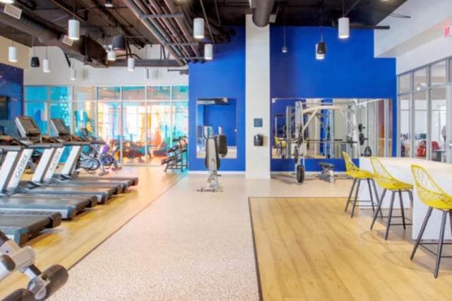 Treadmills weight machines yellow chairs gym at Apollo Tempe in Tempe Student Accommodation