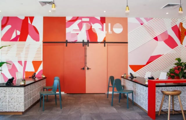 Reception desks with chairs and modern art exterior at Apollo Tempe in Tempe Student Accommodation