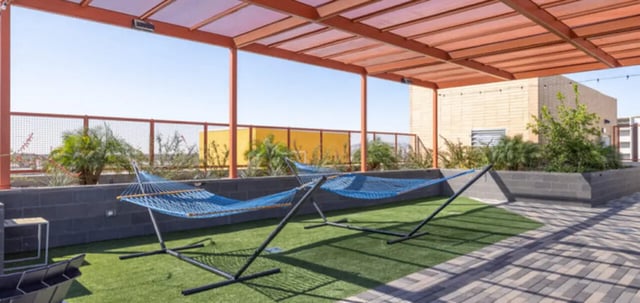 Two blue hammocks on artificial grass patio exterior at Apollo Tempe in Tempe Student Accommodation