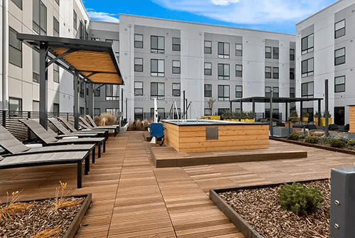 Deck chairs hot tub wood patio exterior at Uncommon Boise State in Boise Student Accommodation