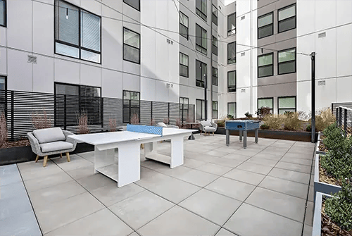 Ping pong table foosball table chairs outdoor area at Uncommon Boise State in Boise Student Accommodation